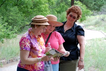 visitors with a trail guide