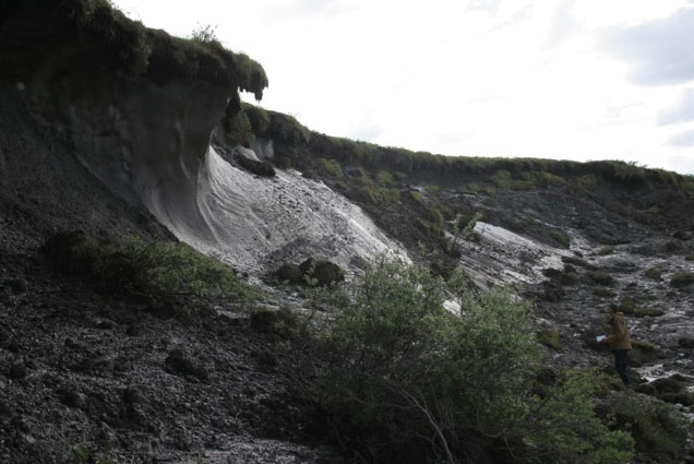 NPS ecologist David Swanson investigating a thaw slump