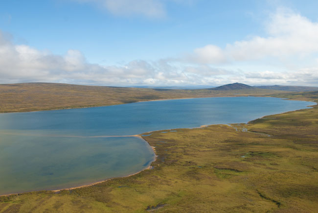 Kuzitrin Lake displays brilliant colors in the afternoon sun.