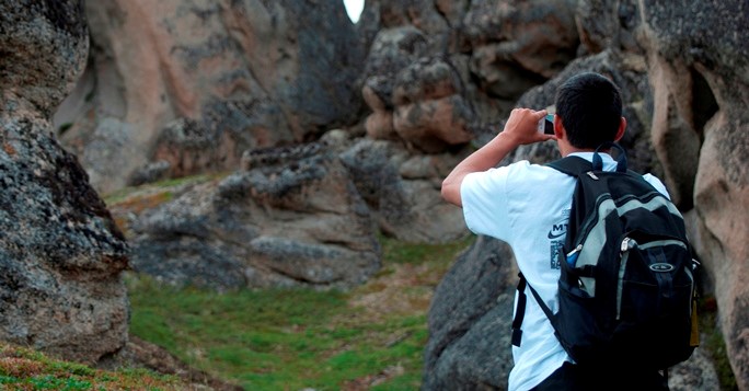 Intern taking a photo at Serpentine Hot Springs