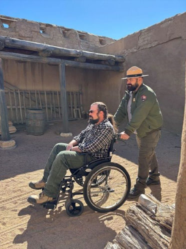 Ranger assists visitor in wheelchair