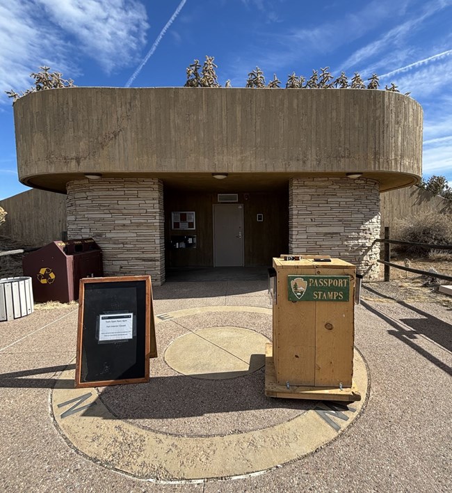 Podium with passport stamping station installed in front of public rest area