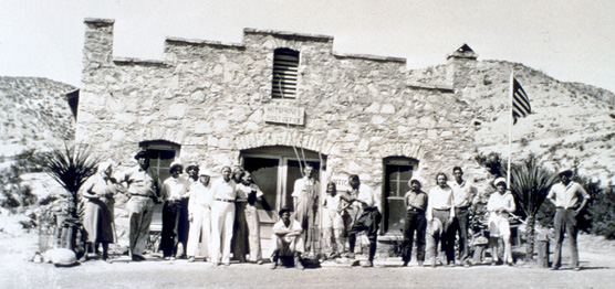 Visitors stand in front of the Hot Springs store & post office, 1930s.