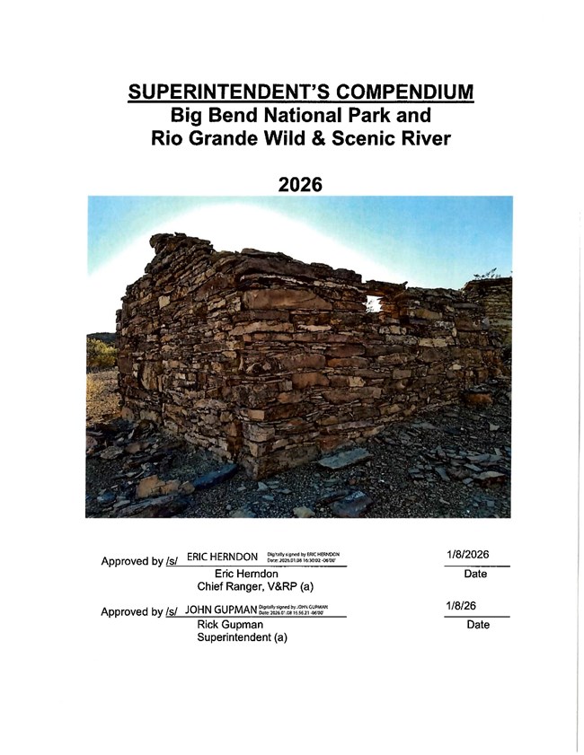 A structure composed of stacked rocks dominates the frame.