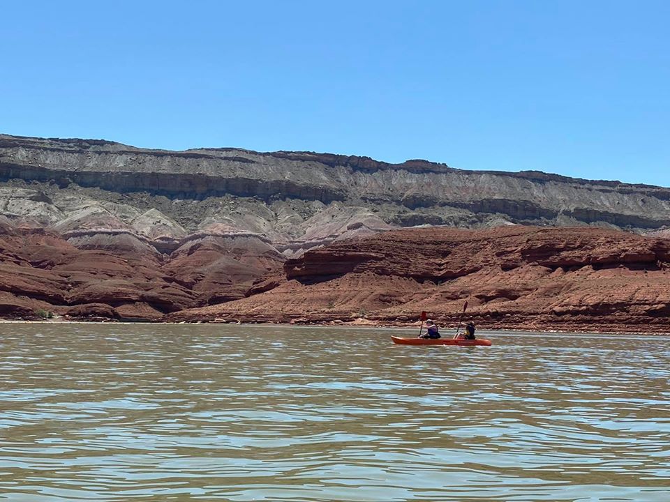 Kayaking at Horseshoe Bend A double kayak with two females paddle at horseshoe bend.