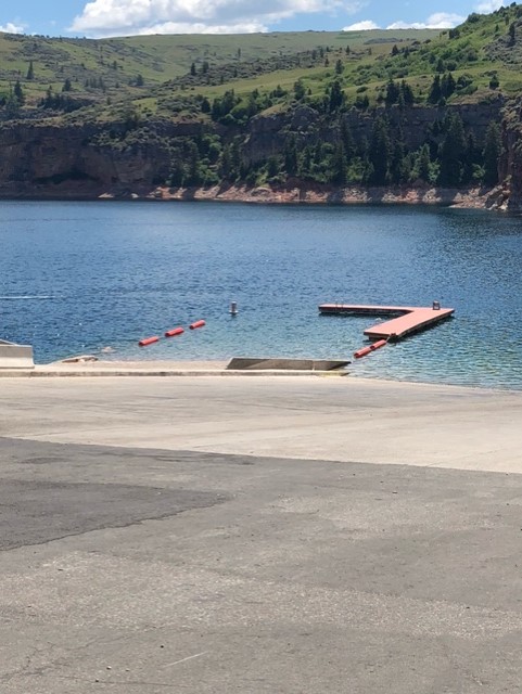 A dock with ladders in an L shape forms the swim area at Ok-A-Beh marina.