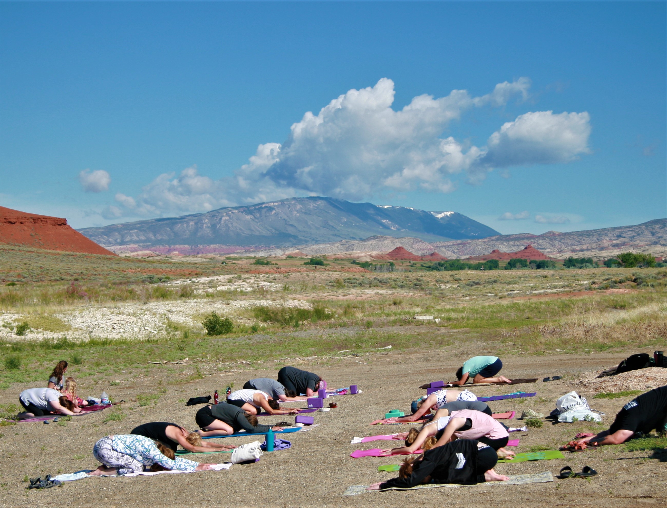 Childs Pose 20 participants enjoy childs pose at yoga on the beach at Horseshoe Bend.