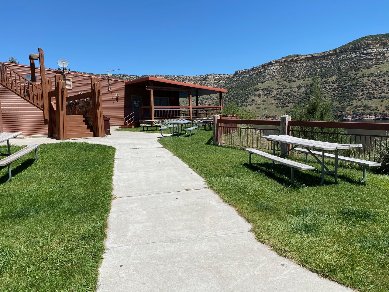 Front lawn of OkABeh Marina with picnic tables.