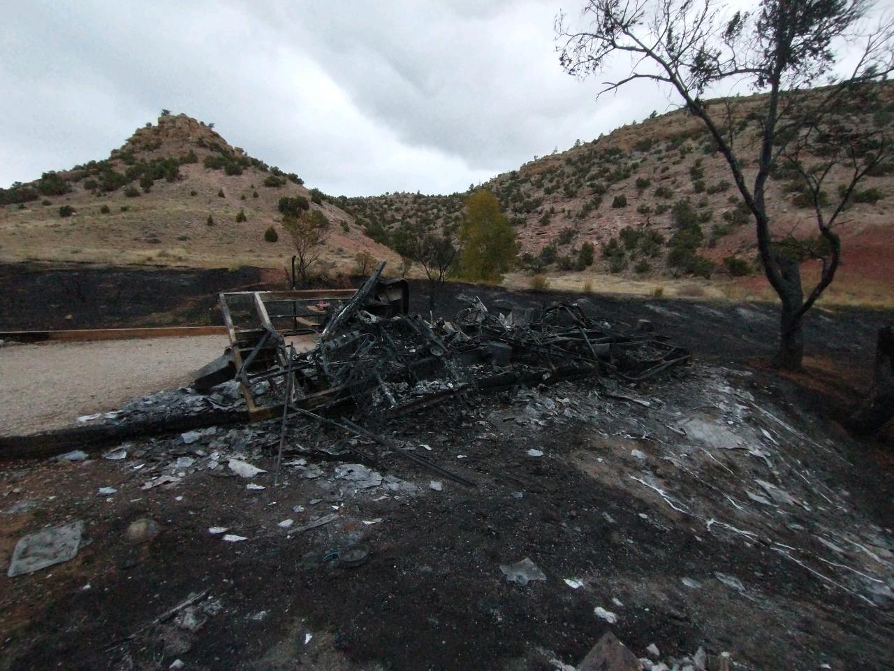 What remains of a 5th wheel trailer after a fire. The metal remains of a 5th wheel trailer after a fire.