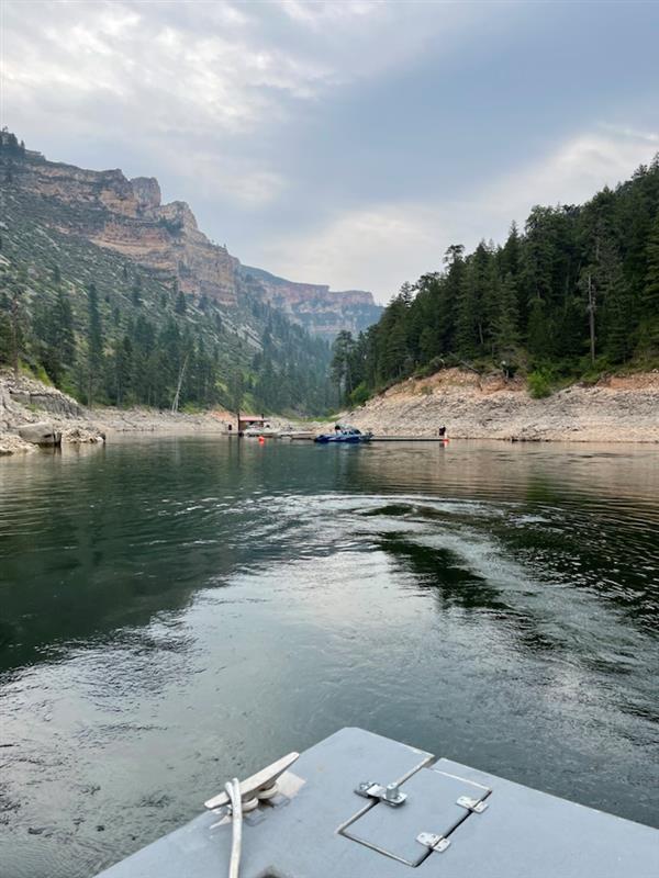 Looking into black canyon side canyon with steep walls and a dock system.