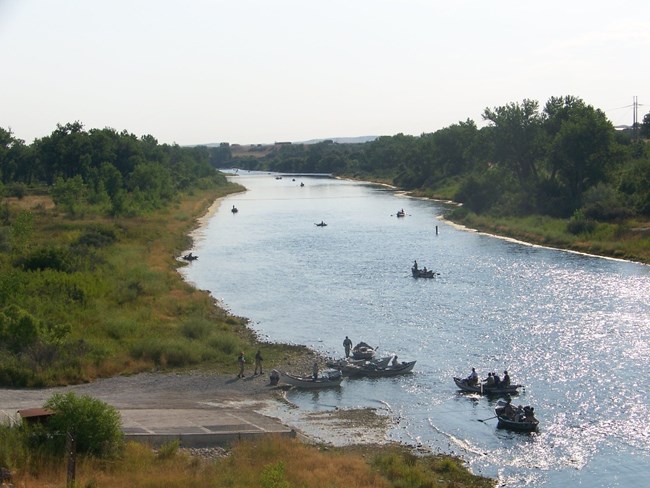 Fisherman enjoy the Bighorn River on a warm summer day