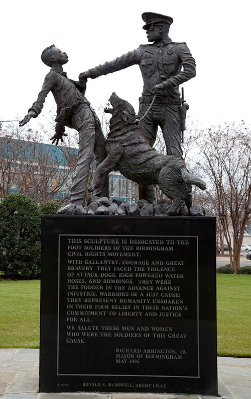 Sculpture of policeman and dog attacking civil rights footsoldier in Kelly Ingram Park.