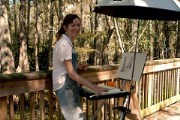 Lynn Uhlmann working on her art in Big Cypress National Preserve