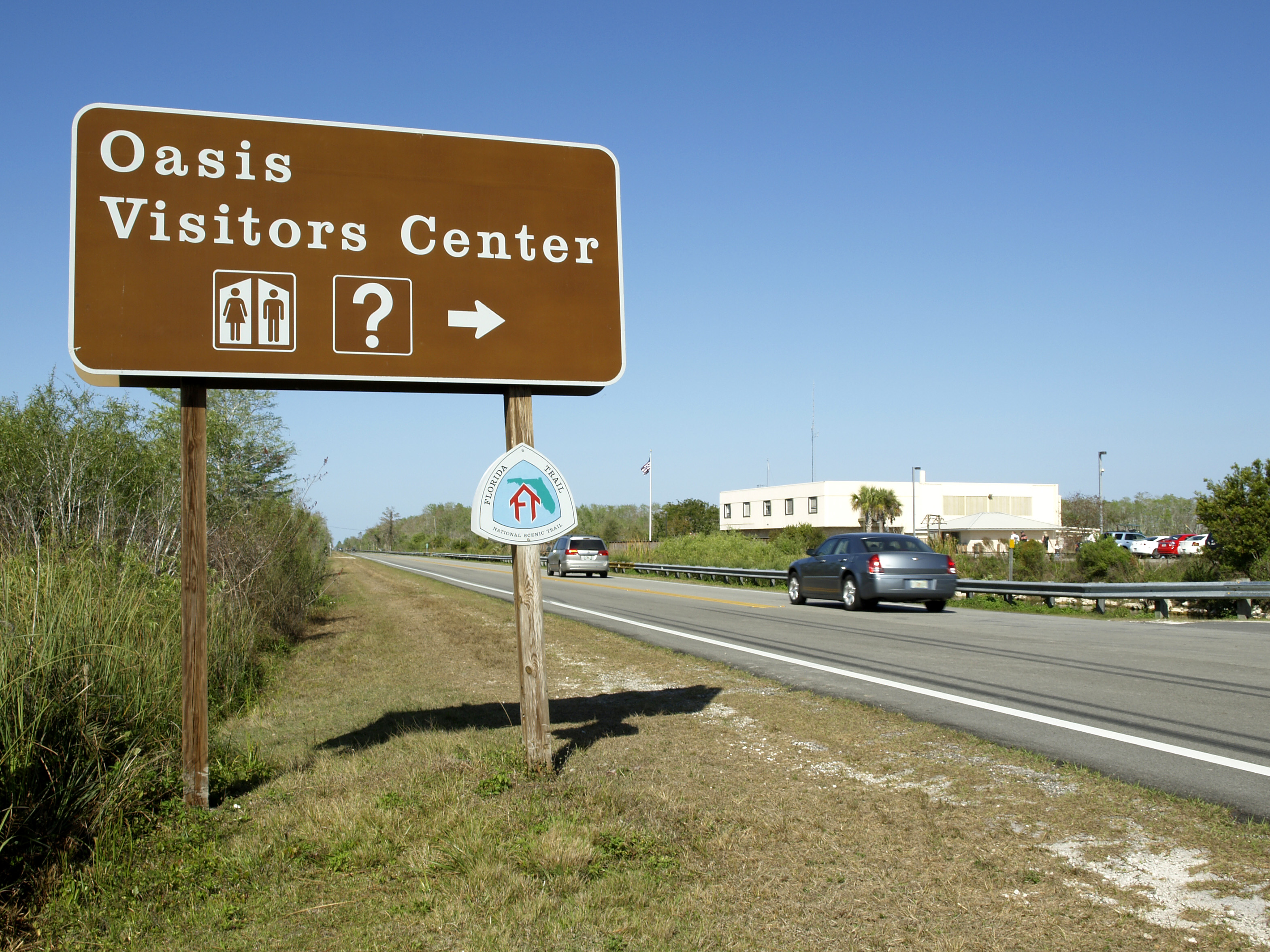 Visitor Center Sign in foreground, building in background