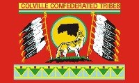 A red flag with a wolf howling and eleven feathers on the sides