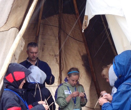 Students practice skills with a cultural demonstrator during Coyote Camp.