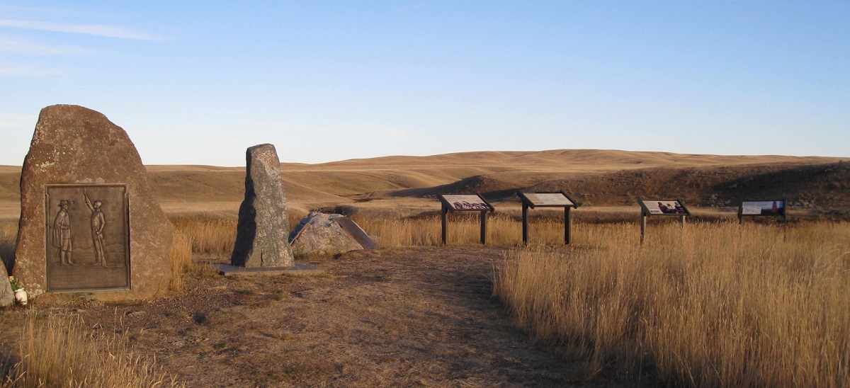 photo of stone monuments and information signs overlooking rolling hills in fall color. photo of stone monuments and information signs overlooking rolling hills in fall color.