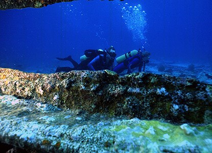 SCUBA divers explore the wreck of the <i>Alicia</i>.