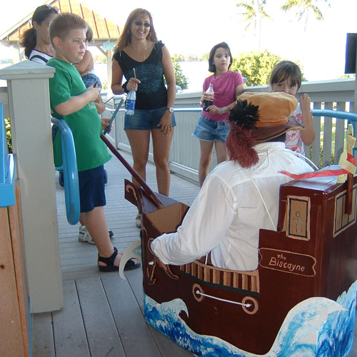 A ranger dressed as a Spanish ship captain speaks to children.