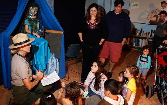 Kids listen to the story of Cassipopeia from Ranger Moira.