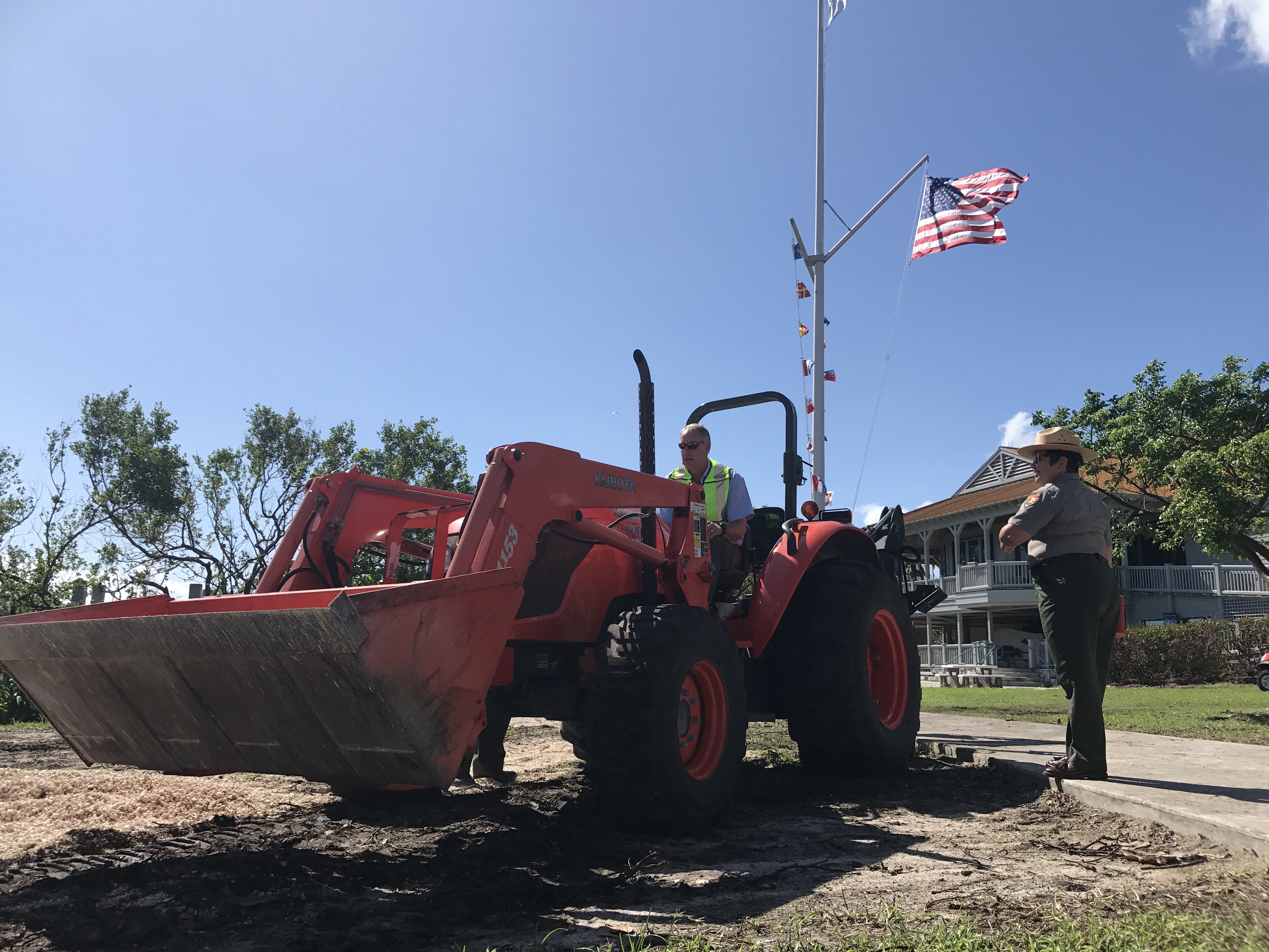 Secretary Zinke operating a tractor to repair a popular picnic area.