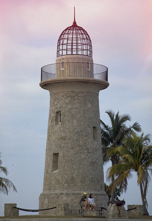 Two park visitors enjoying twilight at Biscayne National Park’s historic ornamental lighthouse on Boca Chita Key.