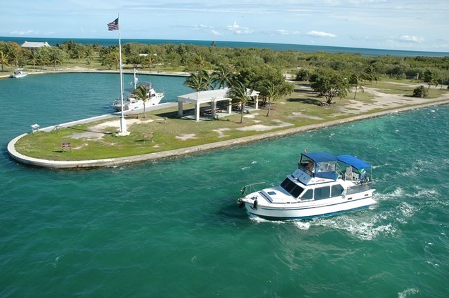 boat entering Boca Chita Key harbor