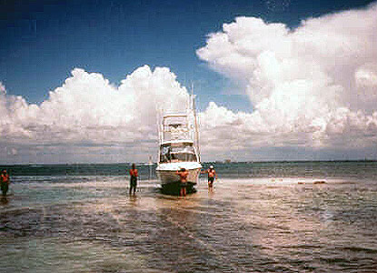 Powerboat hard aground Powerboat hard aground