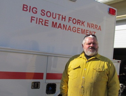 Tommy Barnes standing next to fire engine