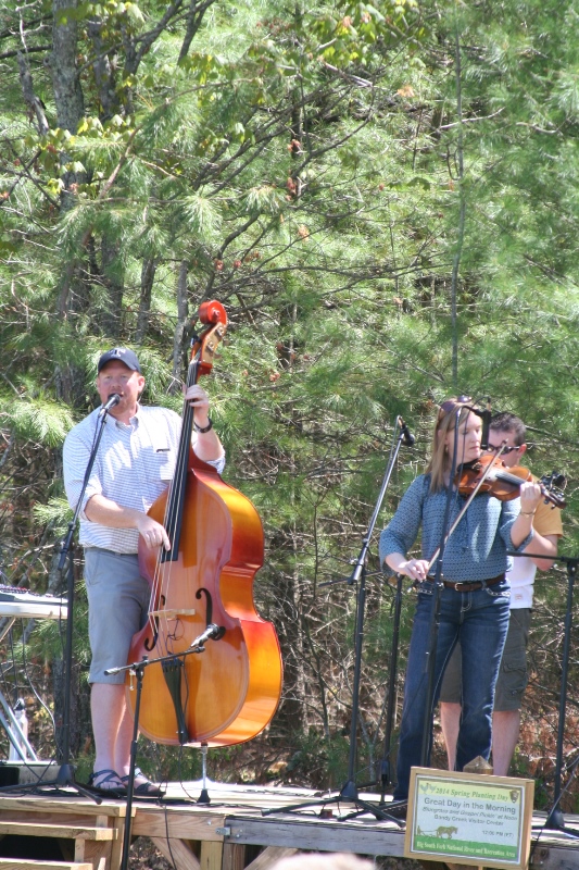 Band playing on stage with fiddle and cello