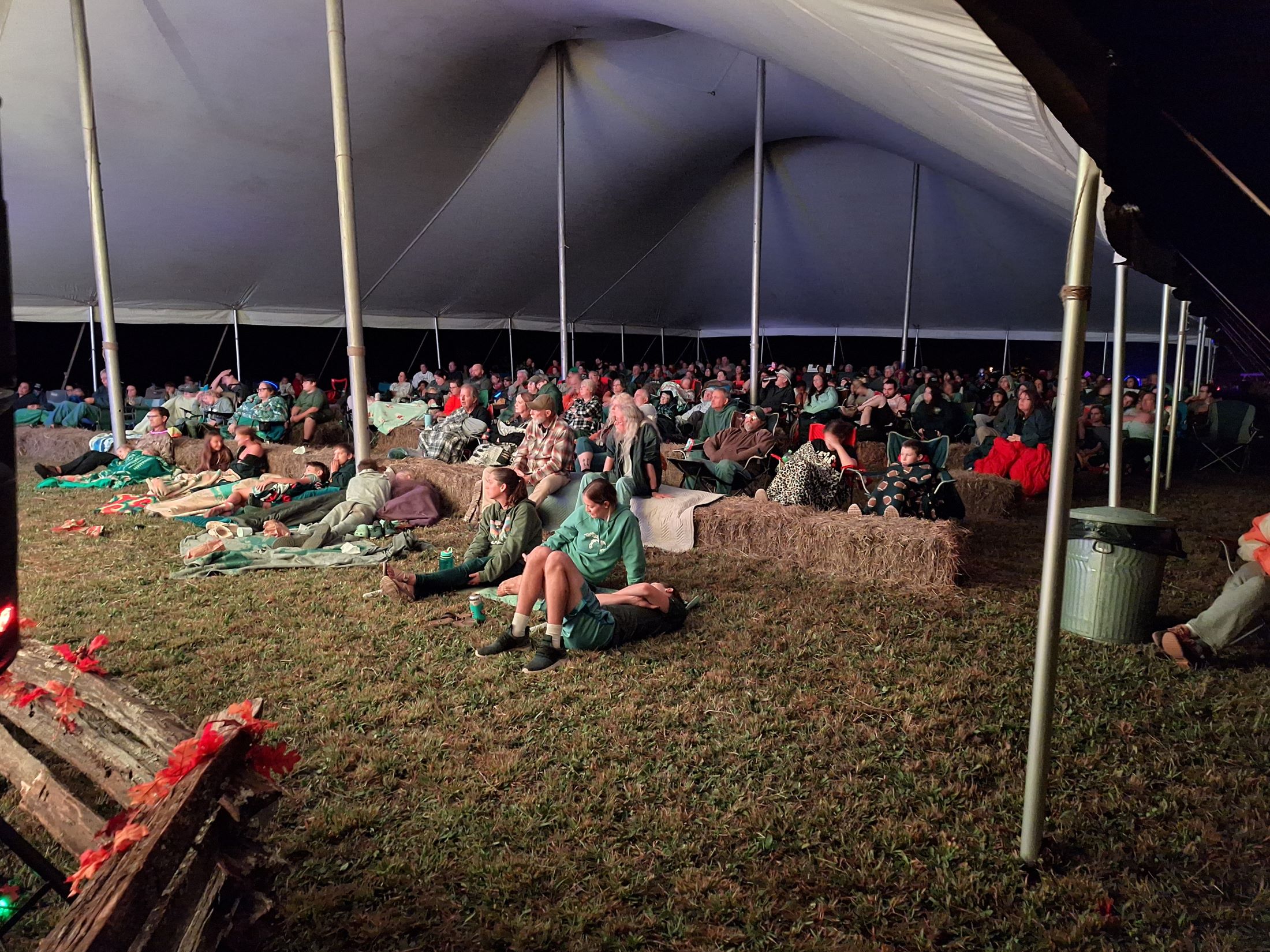 Storytelling Event Image A large group of visitors sitting under a tent listening to haunted stories.
