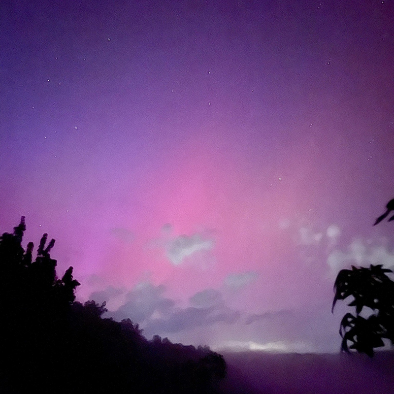 Aurora Borealis glowing brightly in the night sky.