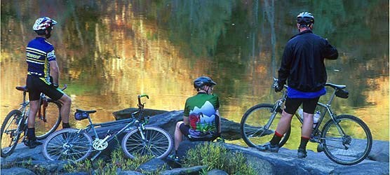 Mountain bikers rest along the banks of North White Oak Creek.