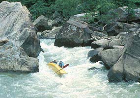 Canoe overturning at Devils Jump Rapids on Big South Fork River. Canoe overturning at Devils Jump Rapids on Big South Fork River.