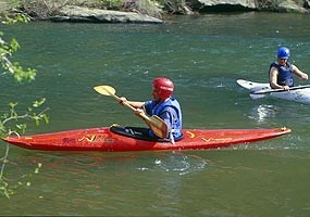 Kayakers paddling down the Big South Fork River.