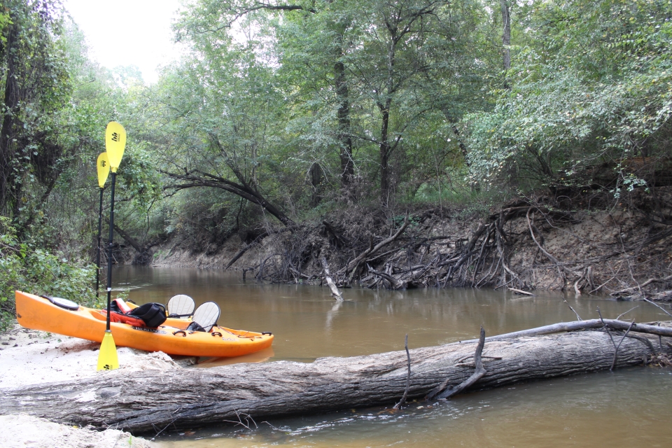 Kayaks on Village Creek 2 kayaks on the beach next to a river