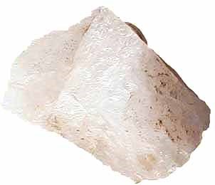 Image cutout of a large transparent rock on a white background