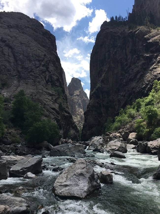 steep and narrow canyon view from river below