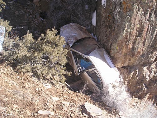 car wedged in canyon