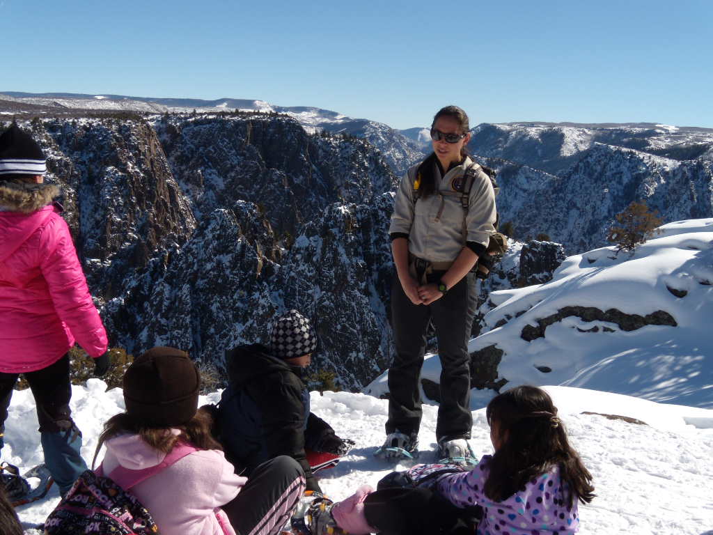 Volunteer Amanda Sweeney leads snowshoe program