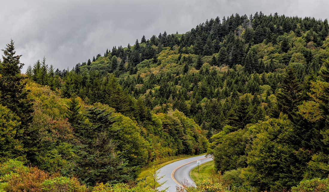 The road winding along crest of a mountain in autumn