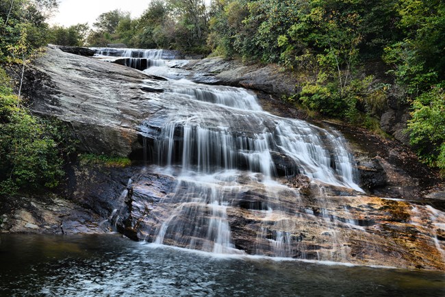 Water cascades down a series of rocks at the Lower Falls in Graveyard Fields