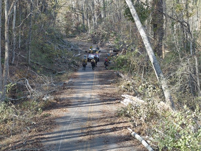 Crew clearing road debris