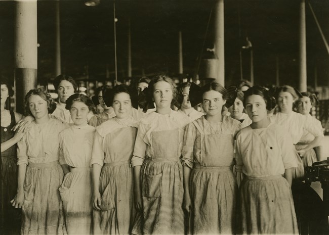 Group of young women working in mill