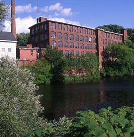 Brick mill with Blackstone River in foreground