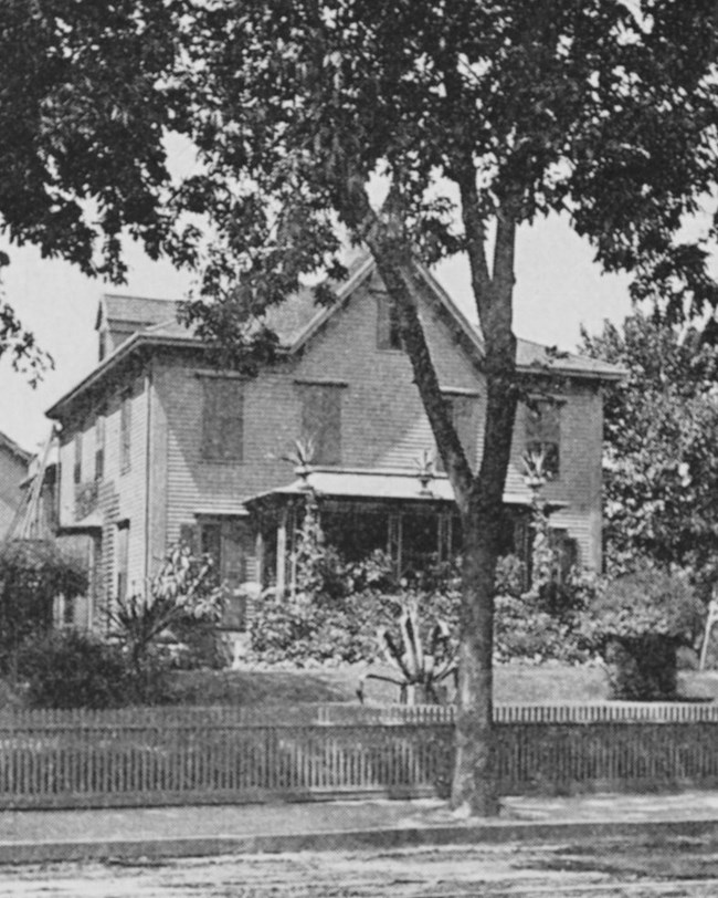 House on a street. Black and white photograph