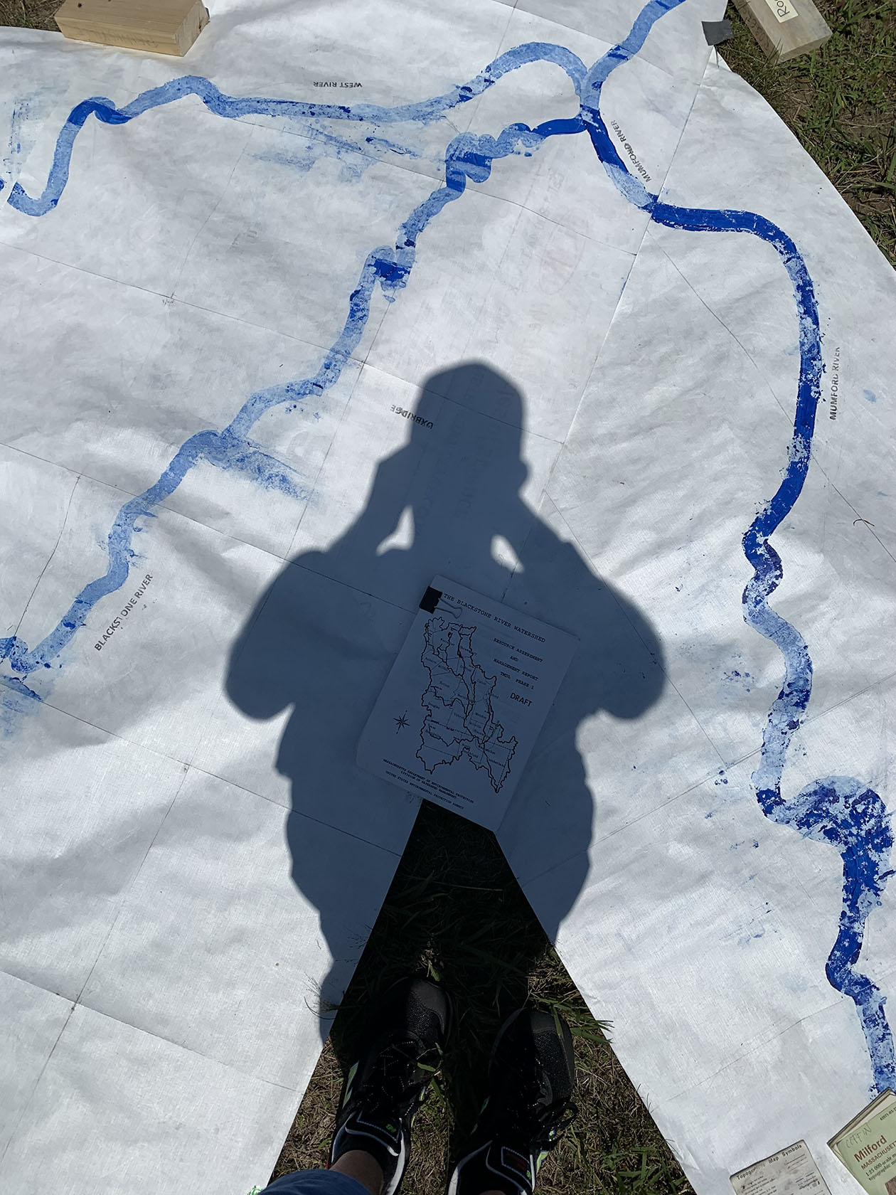Shadow figure standing over a map Blackstone