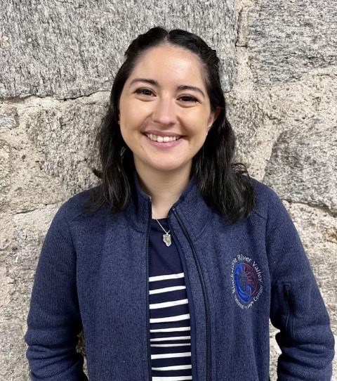 Cardoza Woman with black hair wearing a blue sweatshirt