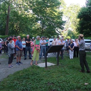 lt= Park Ranger giving a tour to visitors