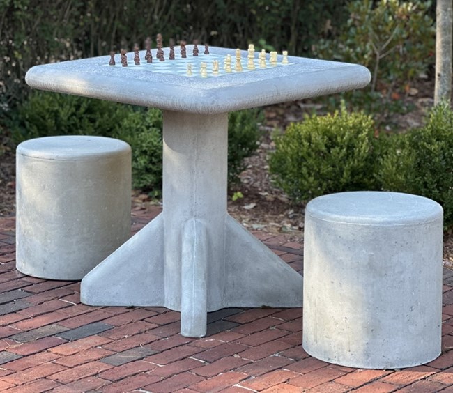 chess table_resized Outdoor chess table with two stools on brick path